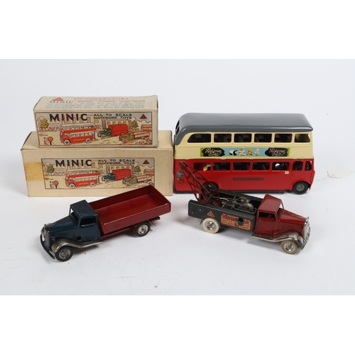 348 - 3 Tri-ang Minic Clockwork Vehicles. A well repainted Route 14 double decker bus in cream, red and gr... 