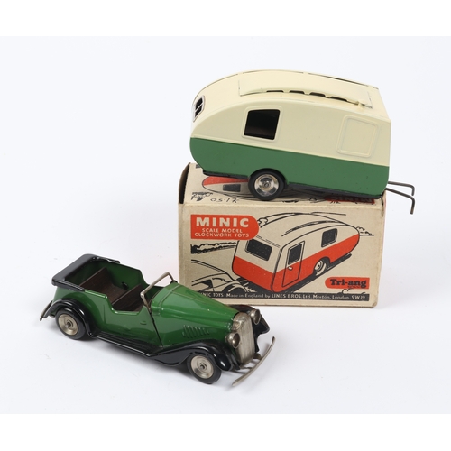 361 - 2 Tri-ang Minic. A clockwork Vauxhall Learner Car Tourer. In dark green with black mudguards, runnin... 