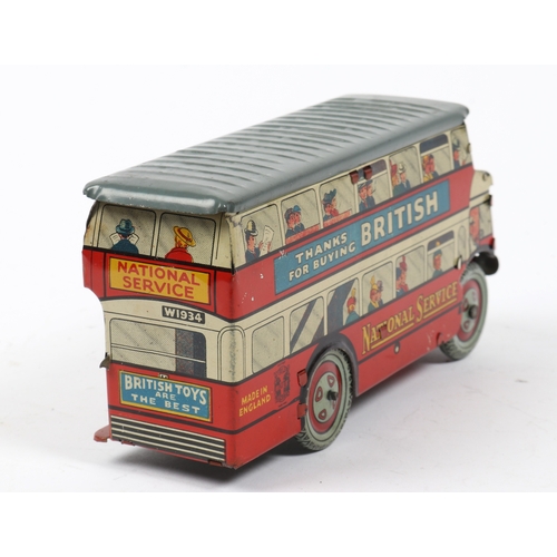 380 - Wells toys Tinplate bus with thanks for buying British and National Service to each side, Has a grey... 