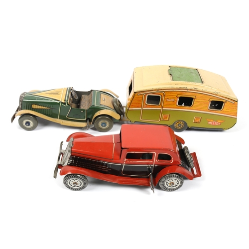 392 - 2 METTOY tin plate win up cars, open top sports car in green and tan, with spare wheel attached to r... 