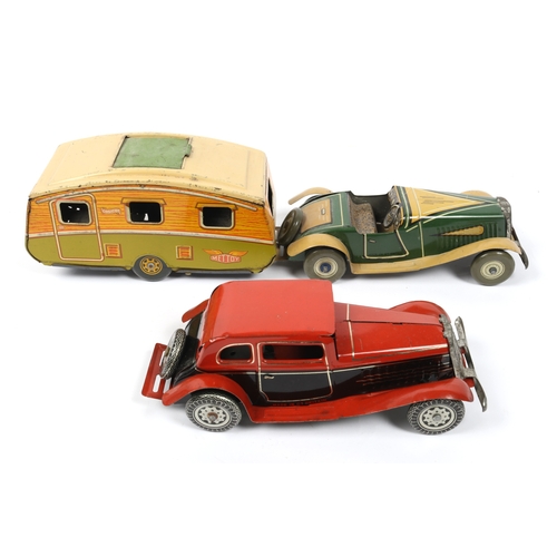 392 - 2 METTOY tin plate win up cars, open top sports car in green and tan, with spare wheel attached to r... 