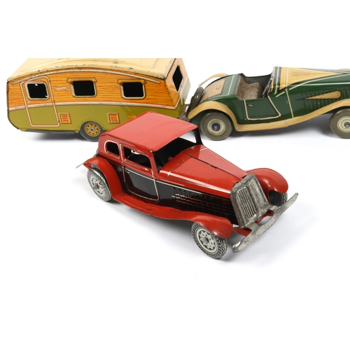 392 - 2 METTOY tin plate win up cars, open top sports car in green and tan, with spare wheel attached to r... 