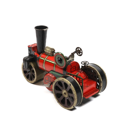 396 - A possibly German produced tinplate road roller, finished in red and green, has a clock work motor t... 