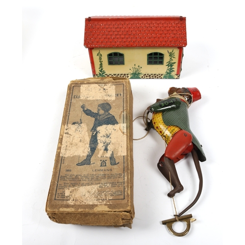 397 - A LEHMANN climbing monkey toys, dating from the early 1900s. Monkey is dressed in a green tail coat ... 