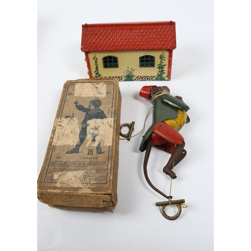 397 - A LEHMANN climbing monkey toys, dating from the early 1900s. Monkey is dressed in a green tail coat ... 