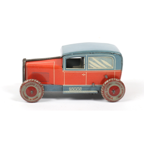 405 - A very scarce 1920s  Tinplate saloon car made in Germany by MARKE STOCK, finished in lined red litho... 