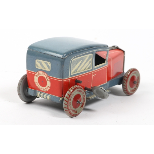 405 - A very scarce 1920s  Tinplate saloon car made in Germany by MARKE STOCK, finished in lined red litho... 