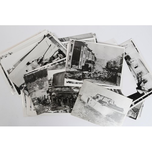 11 - A large quantity of black and white reprints of WWII photographs of German and allied vehicles in ac... 