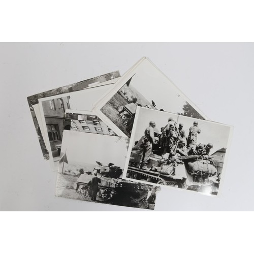 11 - A large quantity of black and white reprints of WWII photographs of German and allied vehicles in ac... 
