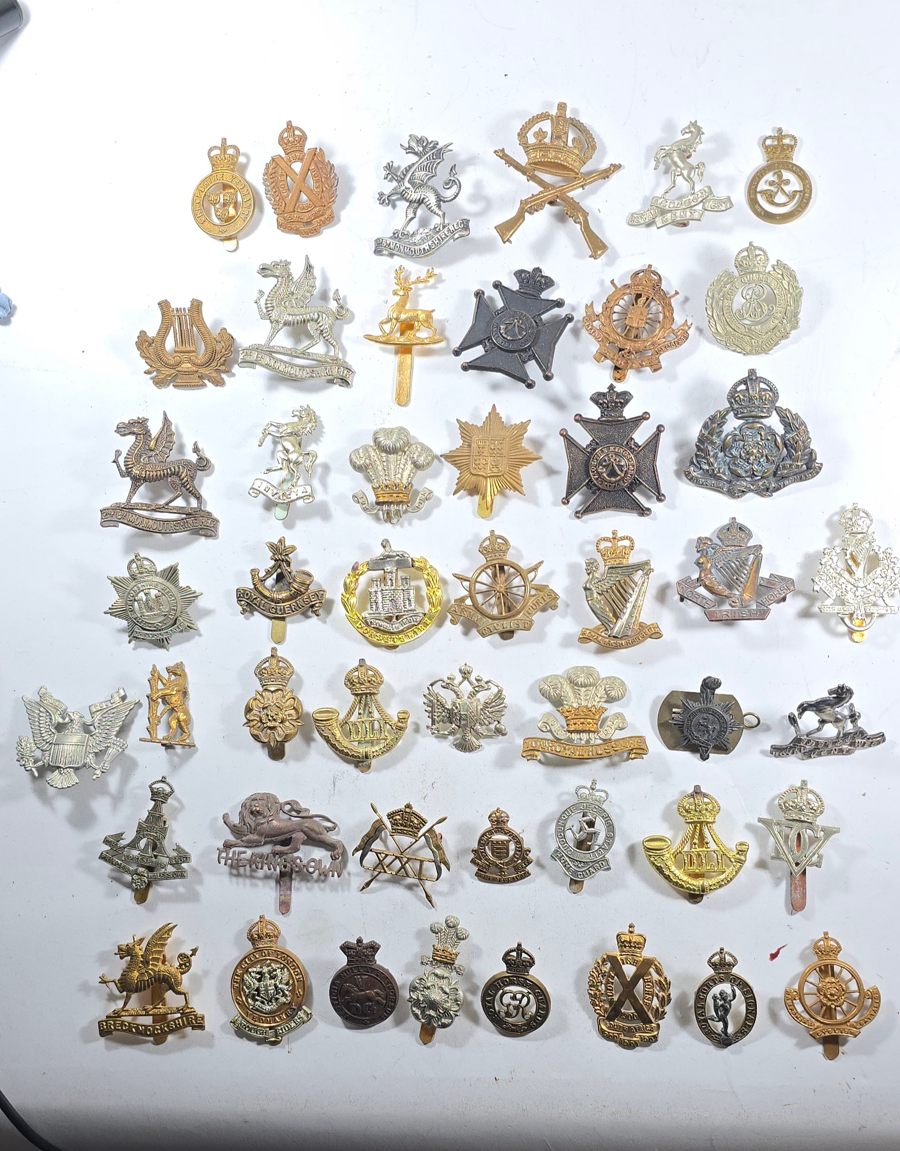 Over 80 restrike cap and other badges, including many Yeomanry, some by ...