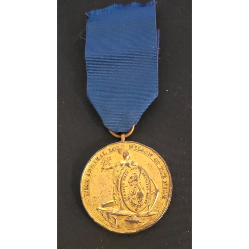 35 - Mr Davidson's battle of the Nile medallion in gilt (petty officers) The field engraved 'John Sterlin... 