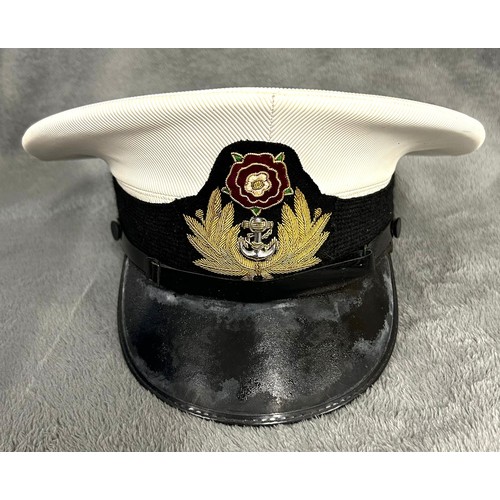 188 - A Naval Nautical Training Corps officer's cap with bullion badge; and a blue wool yachting cap with ... 