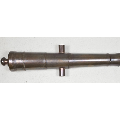 6 - A good antique miniature bronze canon barrel, 18cms overall, well formed with pleasing bronze patina... 