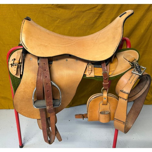 239 - A leather saddle with prominent iron frame, leather stencilled JCCO 1988 429 5127 TS, nickel stirrup... 