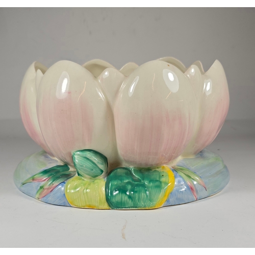 1 - A Clarice Cliff large bowl in the form of a lily pad, finished in bright colours , with a pink lily ... 