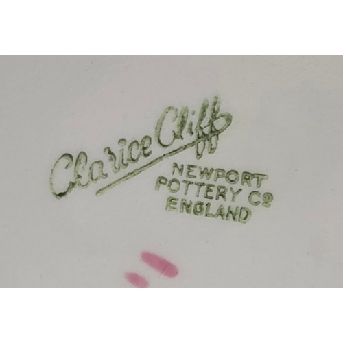 1 - A Clarice Cliff large bowl in the form of a lily pad, finished in bright colours , with a pink lily ... 