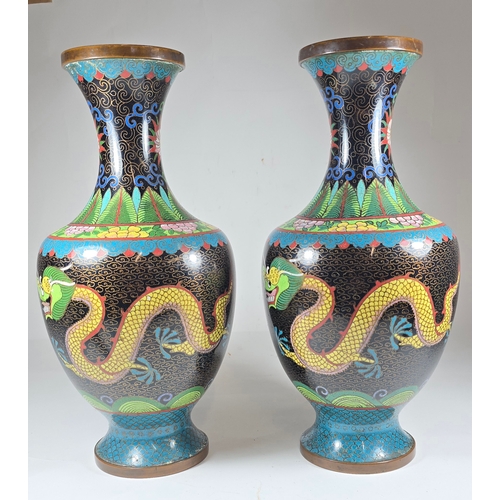 36 - A pair of oriental cloisonné vases, finished in bright colours; yellow, blue/green, yellow, and red,... 