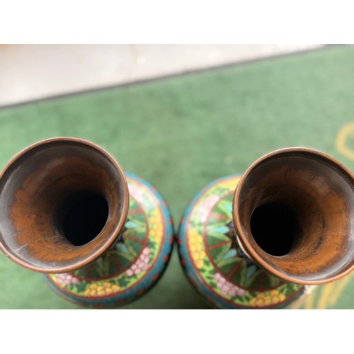 36 - A pair of oriental cloisonné vases, finished in bright colours; yellow, blue/green, yellow, and red,... 