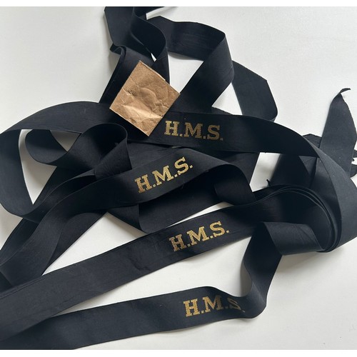 246 - An unissued bundle of 7 Royal Navy WW2 era HMS cap tallies with original packing label/binding VGC.