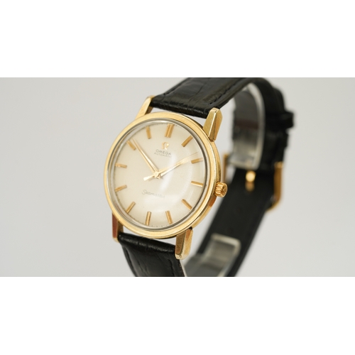 37 - Omega Seamaster Automatic, gold capped. 34.5mm. Reference 165.003. Silver sunburst dial with gilt in... 