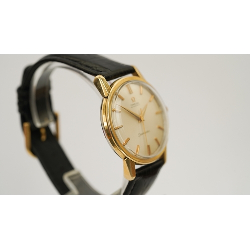 37 - Omega Seamaster Automatic, gold capped. 34.5mm. Reference 165.003. Silver sunburst dial with gilt in... 