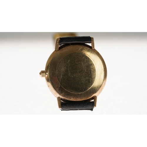 47 - Omega Geneve manual wind wristwatch in gold. 33.5mm. White dial has some staining. Omega signed buck... 