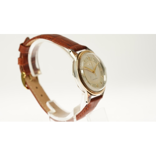 9 - Gentleman's Movado automatic wristwatch in gold and steel. 33mm. Two tone dial with silver inner rin... 