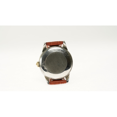 9 - Gentleman's Movado automatic wristwatch in gold and steel. 33mm. Two tone dial with silver inner rin... 