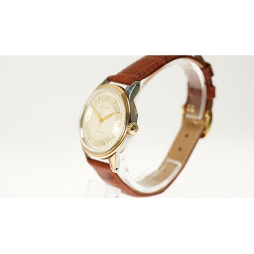 9 - Gentleman's Movado automatic wristwatch in gold and steel. 33mm. Two tone dial with silver inner rin... 