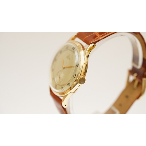 51 - Omega bumper automatic in 14kt gold 'Jumbo' case. 35mm. Silver tone dial with sub-seconds, gilt Arab... 