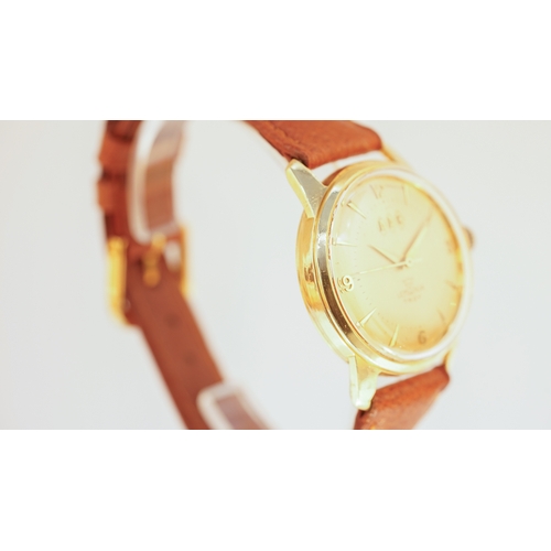 14 - Lemania Troy wristwatch in 18kt gold. 33mm. Gold coloured dial with applied gilt indices and Arabic ... 