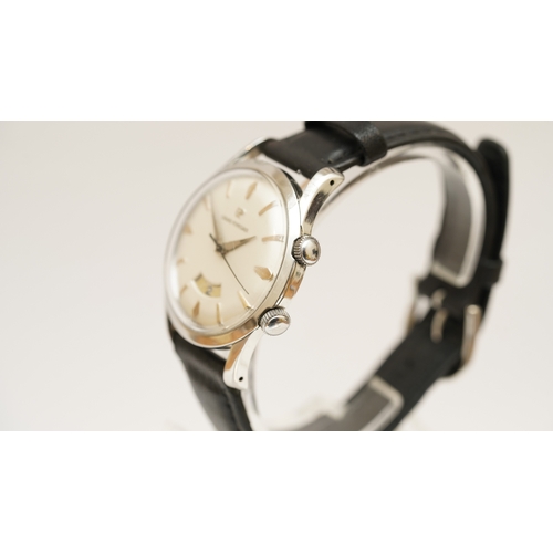 10 - Girard Perregaux Alarm wristwatch in steel. 34mm. White dial with gilt indices, alarm setting window... 