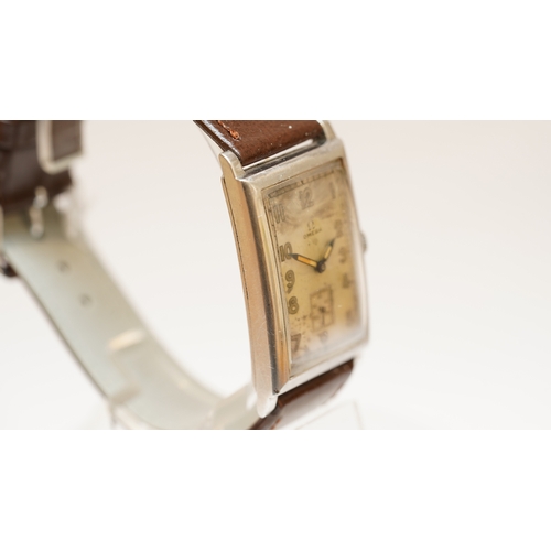 11 - Omega Tank watch in steel, c.1920s-30s. 25mmx42mm. Silvered dial with sub seconds register, luminous... 