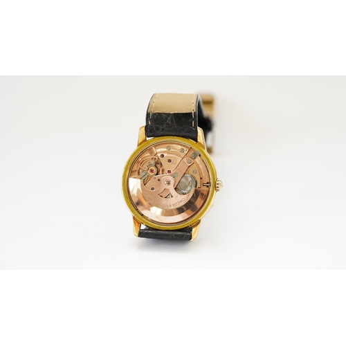 56 - Omega Seamaster, 18kt gold case, 34mm. Reference 165.001. Back carries inscription for 25-years serv... 