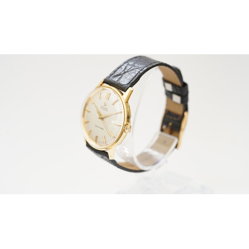 56 - Omega Seamaster, 18kt gold case, 34mm. Reference 165.001. Back carries inscription for 25-years serv... 