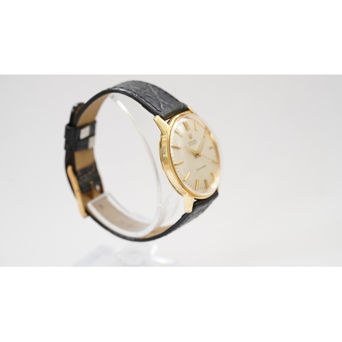 56 - Omega Seamaster, 18kt gold case, 34mm. Reference 165.001. Back carries inscription for 25-years serv... 