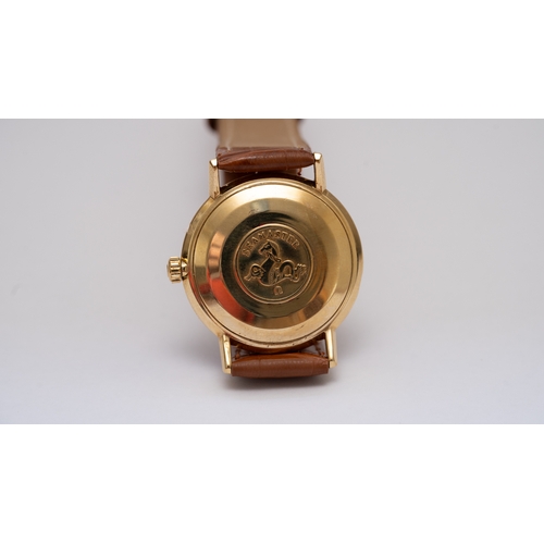 57 - Omega Seamaster Deville date in gold. 34.5mm. Silver dial with gold indices, some spotting. Automati... 