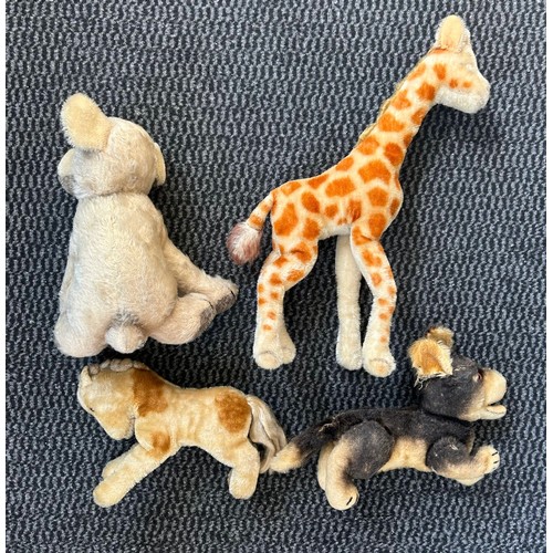 8 - STEIFF. 4 plush animals. Includes Giraffe, Foal, dog with atriculated legs and a puppy. Possibly dai... 