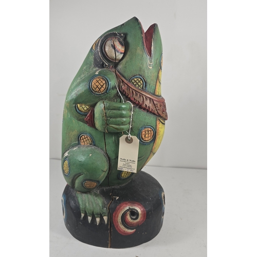 372 - An attractive 20th century Balinese carved wooden kris stand in the form of a standing frog, painted... 