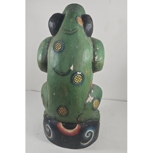 372 - An attractive 20th century Balinese carved wooden kris stand in the form of a standing frog, painted... 