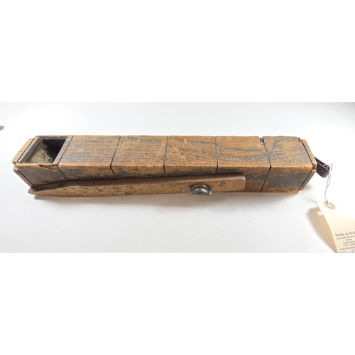 382 - A scarce WW1 American trench periscope, comprising a hollow wooden case 37 x 5.5 x 5cms secured by 7... 