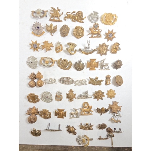 492 - 56 Infantry collar badges, mostly in pairs, singles include Beds & Herts officers silver, gilt a... 