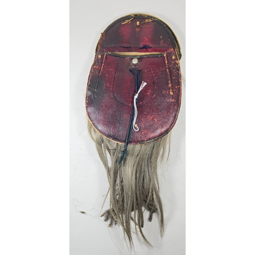 504 - An early 20th century dress sporran, gilt cantle with St Andrew and X In relief together with thistl... 