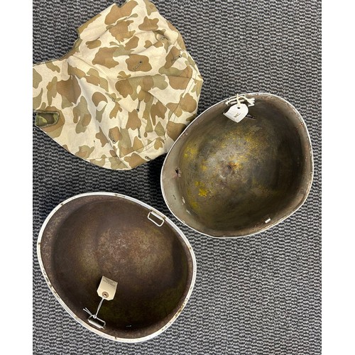 403 - 2x swivel Bale U.S.A style helmets.Battle damage to one1x helmet cover