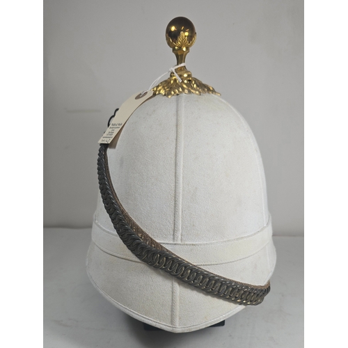 522 - A very scarce Royal Field Artillery Officers foreign service helmet C1890, white cloth with gilt aca... 