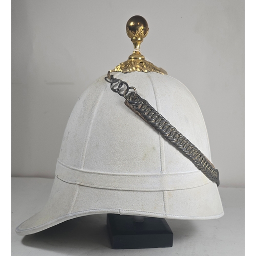 522 - A very scarce Royal Field Artillery Officers foreign service helmet C1890, white cloth with gilt aca... 