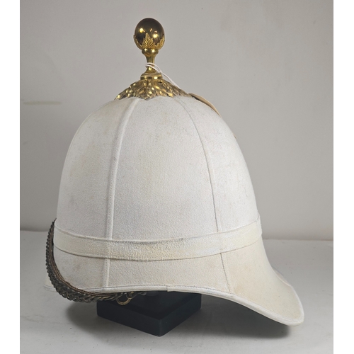 522 - A very scarce Royal Field Artillery Officers foreign service helmet C1890, white cloth with gilt aca... 