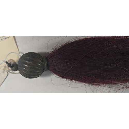 486 - A Cavalry maroon horse hair Throat Plume with spiral spherical brass mount. GC