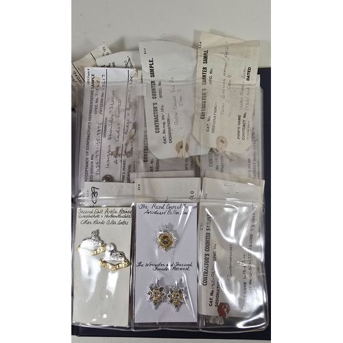 415 - Nineteen London Badge & Button Co. Contractor's Samples for mostly Naval badges, titles and fitt... 