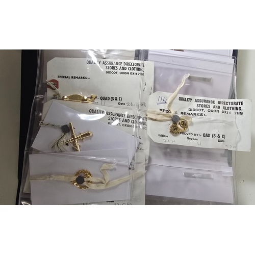 415 - Nineteen London Badge & Button Co. Contractor's Samples for mostly Naval badges, titles and fitt... 